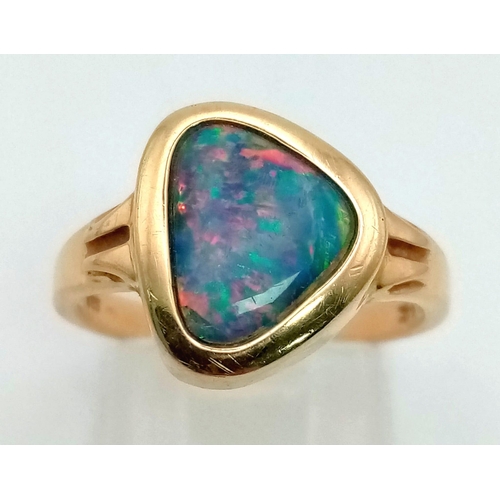 130 - A 14K Yellow Gold Black Fire Opal Fancy Ring. Size N. 3.33g total weight.