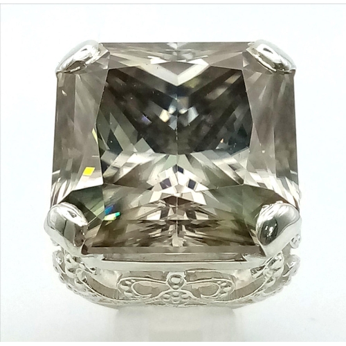 30 - A Rare 79.4ct Brandy Shade Moissanite Ring set in 925 Silver. Size S. 31g total weight.