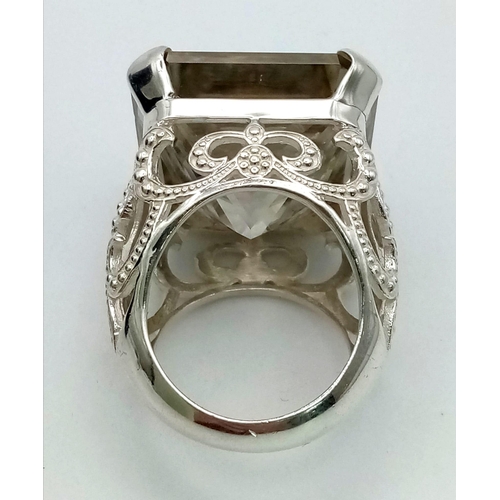 30 - A Rare 79.4ct Brandy Shade Moissanite Ring set in 925 Silver. Size S. 31g total weight.