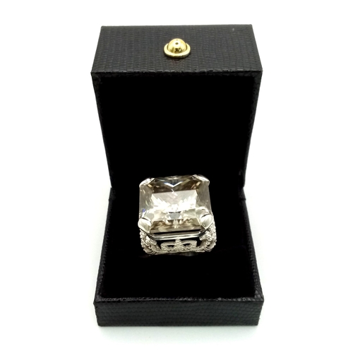 30 - A Rare 79.4ct Brandy Shade Moissanite Ring set in 925 Silver. Size S. 31g total weight.