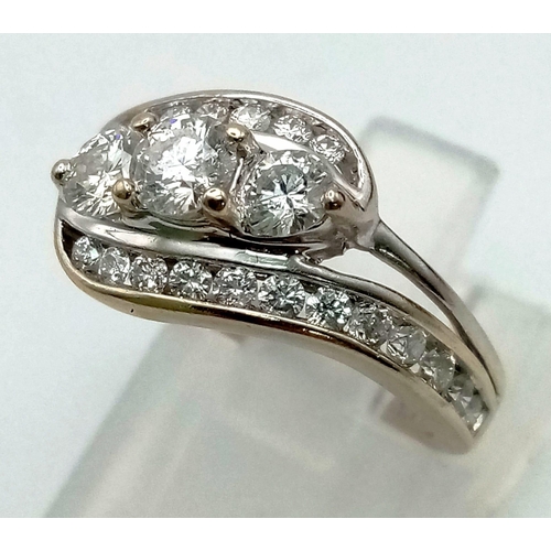 186 - A beautiful baguette and round diamond ring with 1.00 carat of diamonds channel set and diamond on t... 