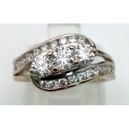 186 - A beautiful baguette and round diamond ring with 1.00 carat of diamonds channel set and diamond on t... 