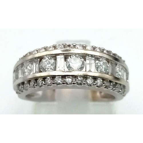 232 - White gold round diamond ring set in a sweeping style with round diamonds in the centre. very elegan... 