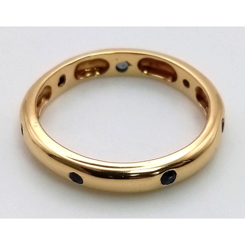 741 - AN 18K GOLD SAPPHIRE AND DIAMOND BAND RING. 3.5gms  size L