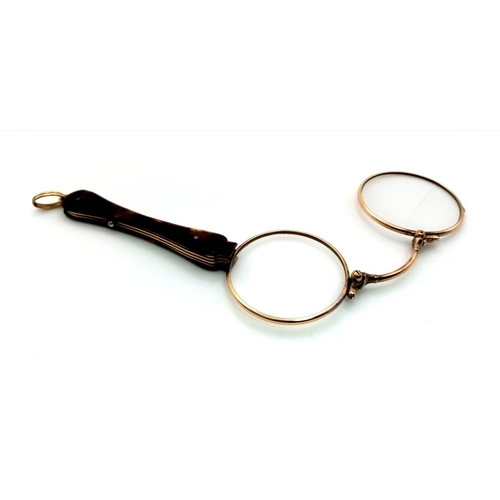 225 - A Victorian pair of 15 carat yellow gold lorgnette spectacles made in France. They have a tortoise s... 