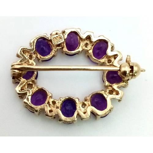 207 - A 9K Yellow Gold Amethyst and Diamond Brooch.  23mm.
Eight clean oval amethysts with diamond spacers... 