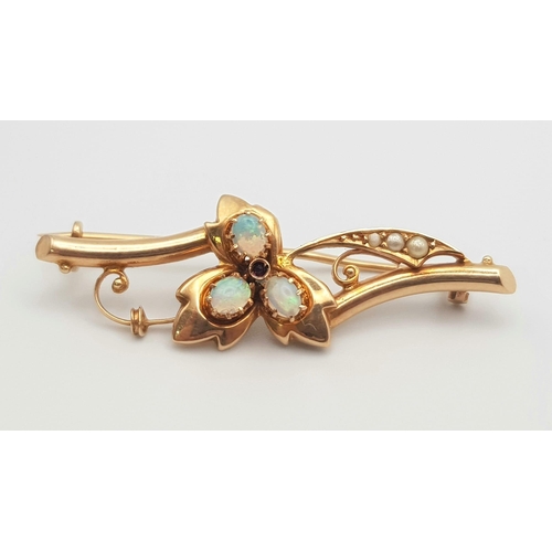 242 - A 15K Rose Gold Victorian Seed Pearl and Opal Stick Pin. Beautifully designed with three opals in a ... 