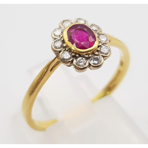 243 - An 18K Edwardian Yellow Gold and Platinum Top, Ruby and Diamond Ring. Central natural oval ruby surr... 