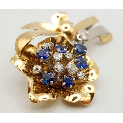 26 - AN 18K YELLOW AND WHITE GOLD DIAMOND AND SAPPHIRE BROOCH IN FLORAL DESIGN.  19gms  0.60ct