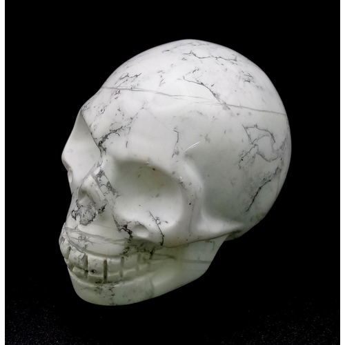 727 - A Hand-Carved  White Howlite Quartz Skull Figure. 5 x 4.5cm