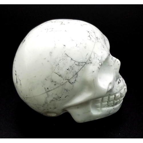 727 - A Hand-Carved  White Howlite Quartz Skull Figure. 5 x 4.5cm