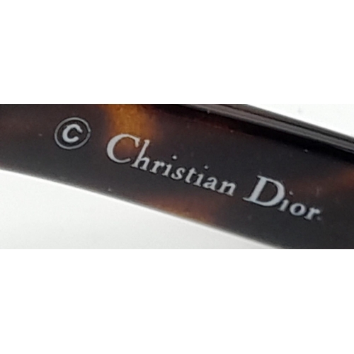 38 - A Pair of Christian Dior Ladies Sunglasses With Tortoise shell Effect Handles. The glasses are in ve... 