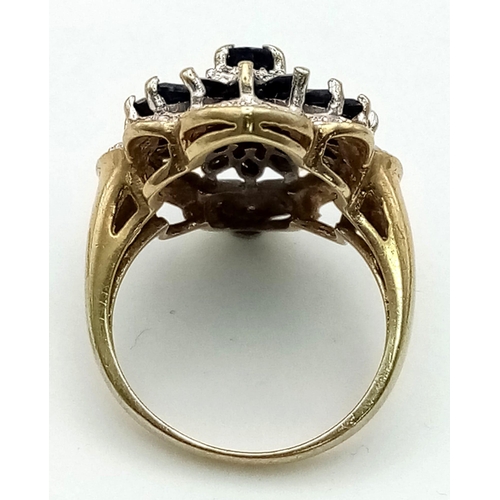 184 - AN IMPRESSIVE 9K YELLOW GOLD DIAMOND & SAPPHIRE CLIUSTER RING IN FLOWER SHAPE, WEIGHT 5.1G SIZE K