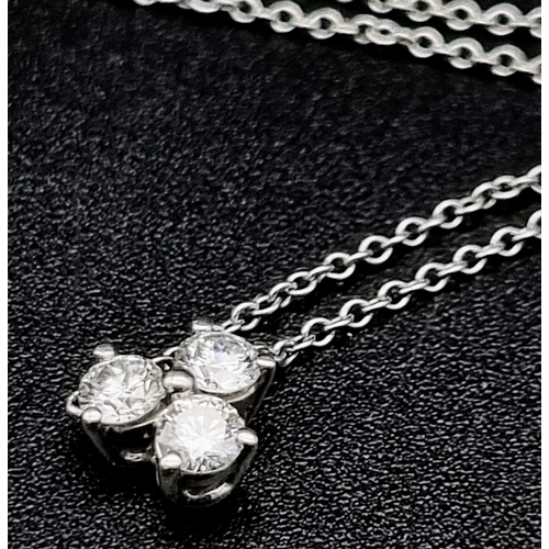 22 - A Tiffany and Co Aria Diamond Pendant on a 950 Platinum Necklace. Three brilliant round cut diamonds... 