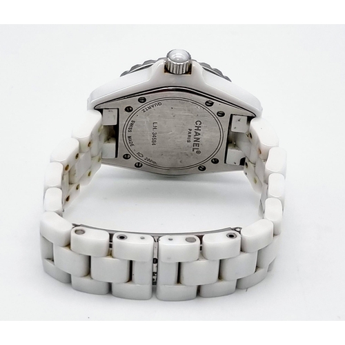 57 - A Chanel J12 Quartz Ladies Watch. White ceramic strap and case - 33mm. White dial with diamond marke... 