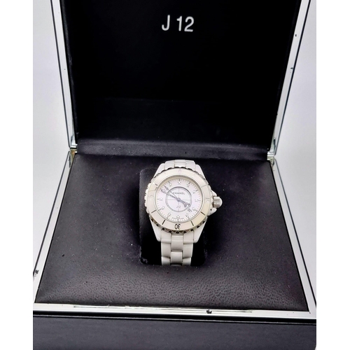 57 - A Chanel J12 Quartz Ladies Watch. White ceramic strap and case - 33mm. White dial with diamond marke... 