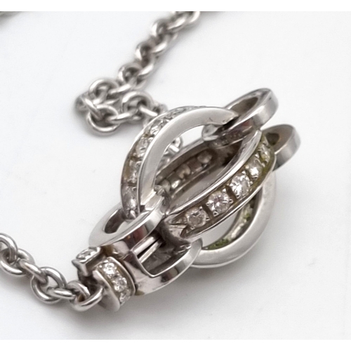 78 - An Italian Made 18K White Gold Garrad Diamond Pendant - On an 18K white gold necklace. Two diamond c... 