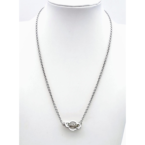 78 - An Italian Made 18K White Gold Garrad Diamond Pendant - On an 18K white gold necklace. Two diamond c... 