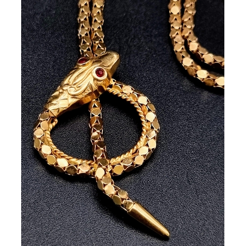 95 - AN IMPRESSIVE 18K YELLOW GOLD SNAKE NECKLACE WITH STONE SET RED EYES, WEIGHT 15.2G AND 52CM LONG CHA... 