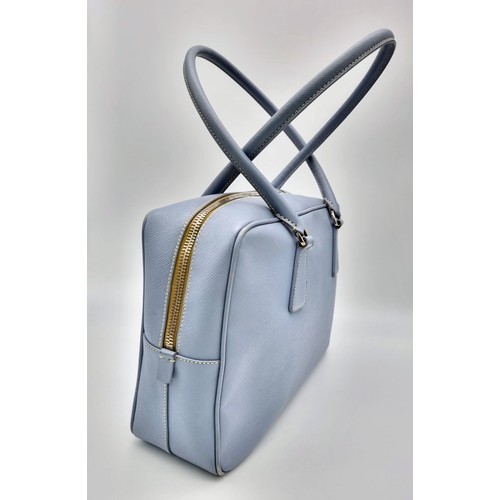 219 - A Prada Pale Blue Leather Mini Tote Bag. Prada log on exterior. Monogram cloth interior with zip poc... 