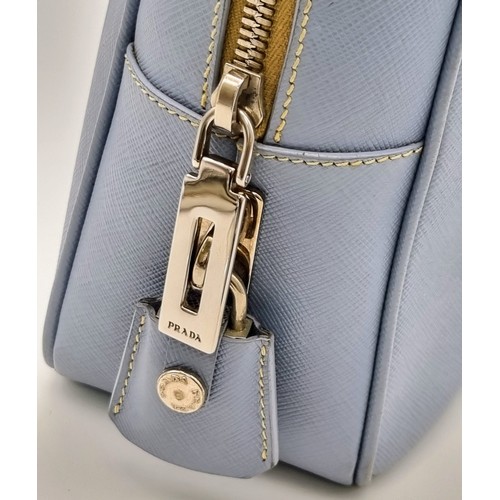 219 - A Prada Pale Blue Leather Mini Tote Bag. Prada log on exterior. Monogram cloth interior with zip poc... 