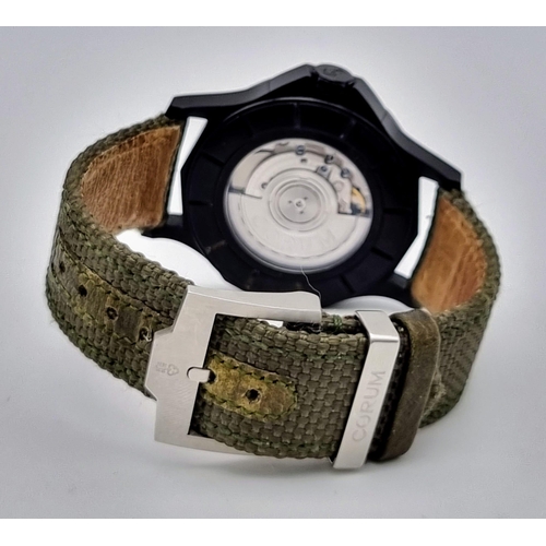 18 - A Corum Admiral's Cup Gents Watch. Green fabric strap. Black steel case - 42mm. Green dial with sub ... 