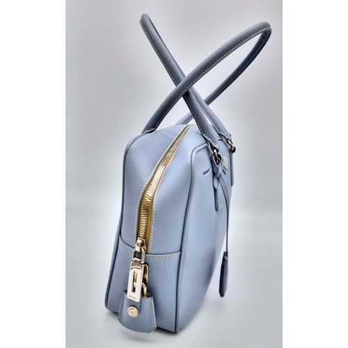 219 - A Prada Pale Blue Leather Mini Tote Bag. Prada log on exterior. Monogram cloth interior with zip poc... 