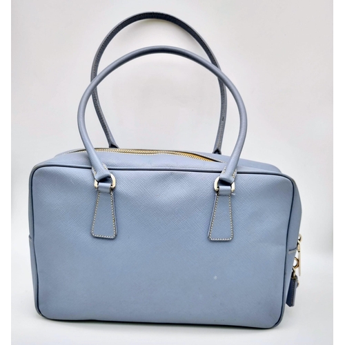 219 - A Prada Pale Blue Leather Mini Tote Bag. Prada log on exterior. Monogram cloth interior with zip poc... 