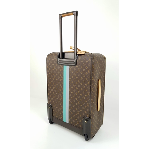 25 - A Louis Vuitton Monogram Suitcase. Brown canvas with leather handle and gilded hardware. On wheels w... 