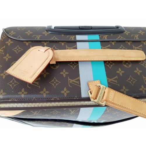 25 - A Louis Vuitton Monogram Suitcase. Brown canvas with leather handle and gilded hardware. On wheels w... 