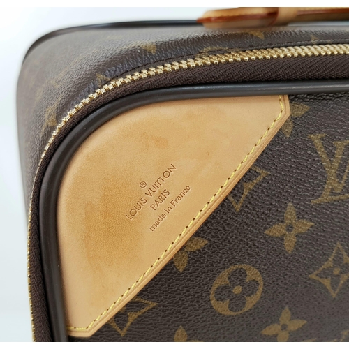 25 - A Louis Vuitton Monogram Suitcase. Brown canvas with leather handle and gilded hardware. On wheels w... 