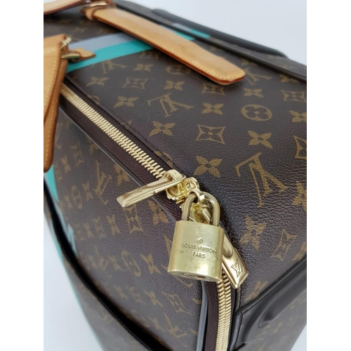 25 - A Louis Vuitton Monogram Suitcase. Brown canvas with leather handle and gilded hardware. On wheels w... 