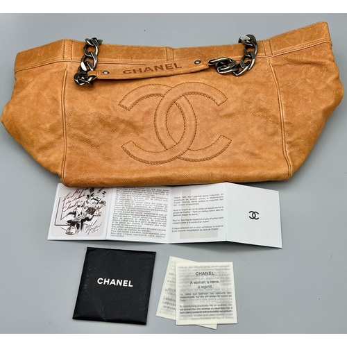 46 - A Chanel Brown Leather Tote Bag. Chanel monogram on outer. Silver tone chain hardware. Soft diamond ... 