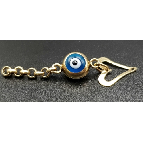 486 - AN EVIL EYE AND HEART DROP PENDANT.  1gm