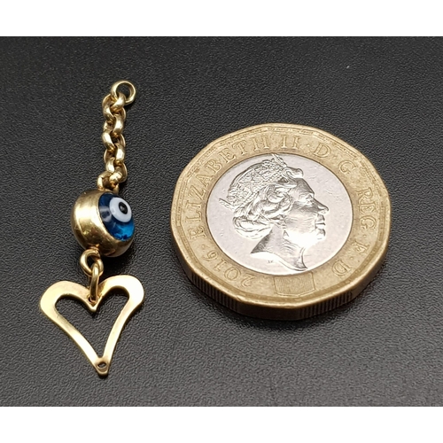 486 - AN EVIL EYE AND HEART DROP PENDANT.  1gm