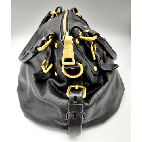 36 - A Prada Soft Black Leather Small Tote/hand Bag. Gilded hardware and Prada logo. Prada monogram inter... 