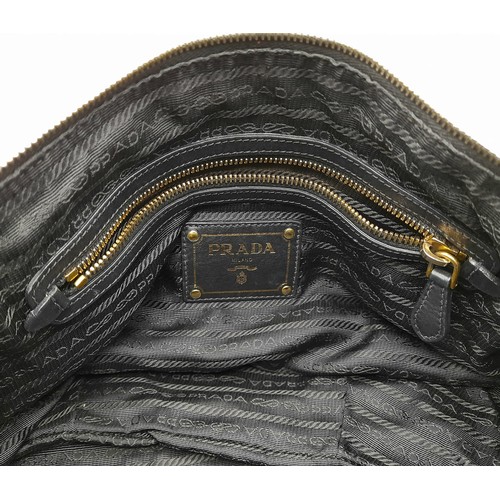 36 - A Prada Soft Black Leather Small Tote/hand Bag. Gilded hardware and Prada logo. Prada monogram inter... 