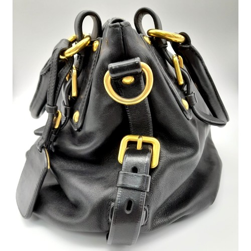 36 - A Prada Soft Black Leather Small Tote/hand Bag. Gilded hardware and Prada logo. Prada monogram inter... 