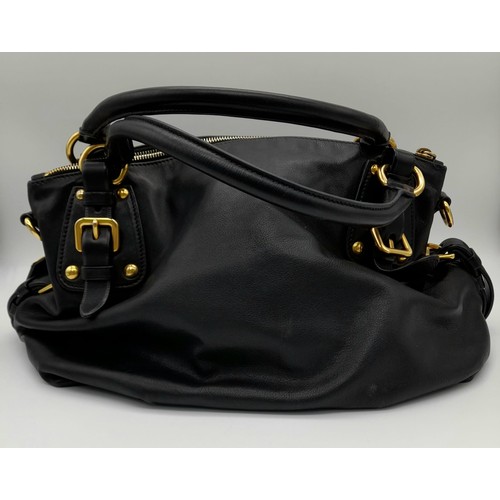 36 - A Prada Soft Black Leather Small Tote/hand Bag. Gilded hardware and Prada logo. Prada monogram inter... 