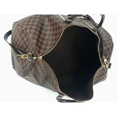 8 - A Louis Vuitton Checked Canvas Keepall Bag. Monogram Canvas and leather exterior. Comes with a shoul... 