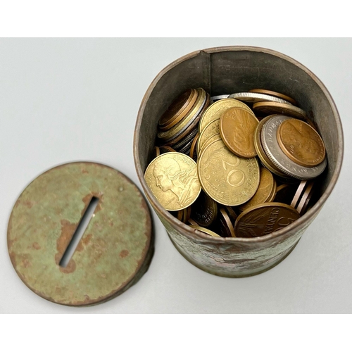 1200 - A vintage money tin full of coins from different parts of the world.