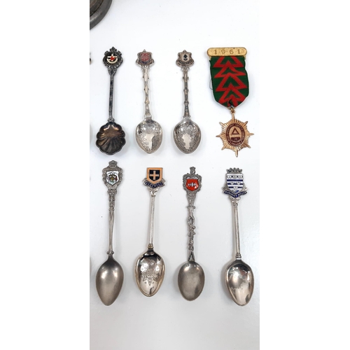 931 - An interesting lot of over 20 collectable silver plated spoons AND an English pewter jug with a glas... 