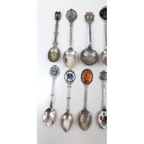 931 - An interesting lot of over 20 collectable silver plated spoons AND an English pewter jug with a glas... 