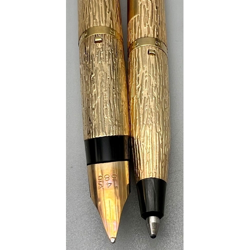 110 - Two Gilded Parker Pens with a Bark Finish. Fountain pen with 14k Gold nib and a ballpoint pen. Comes... 