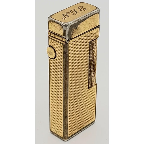 323 - A Vintage Gold Plated Dunhill Lighter. As found