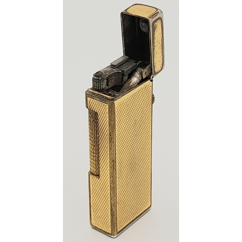 323 - A Vintage Gold Plated Dunhill Lighter. As found