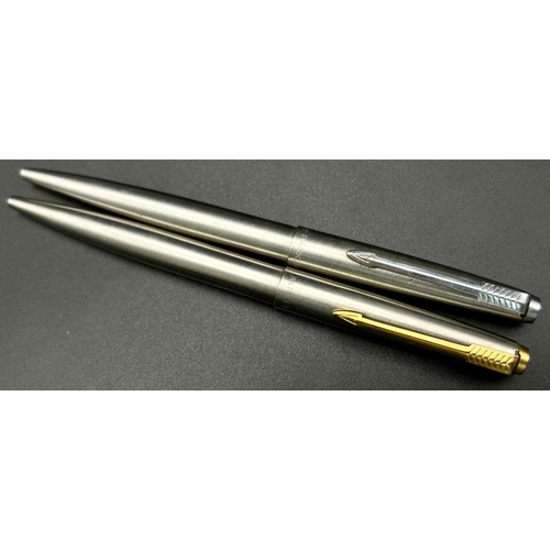 684 - Two Vintage Stainless Steel Parker Ballpoint Pens. In a Parker case. A/F