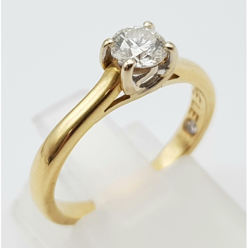 106 - An 18K Yellow Gold Diamond Solitaire Ring - With LEO certificate. Centre round cut stone - 0.34ct. H... 