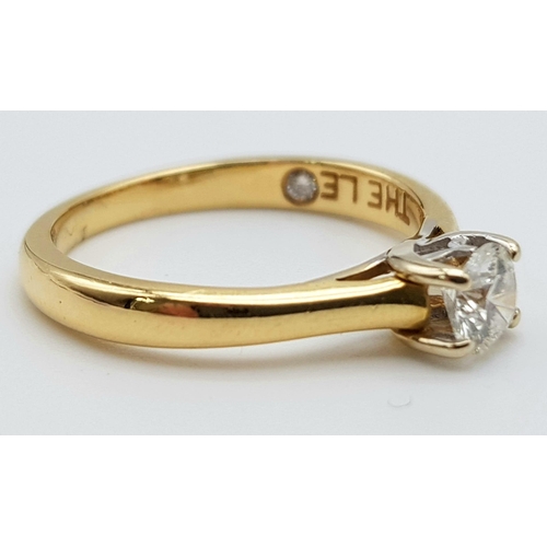 106 - An 18K Yellow Gold Diamond Solitaire Ring - With LEO certificate. Centre round cut stone - 0.34ct. H... 