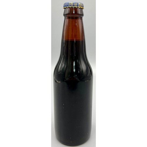 1183 - A 1977 Bottle of Jubilee Ale - Brewed by Greene King and Sons Ltd. 20cm tall.